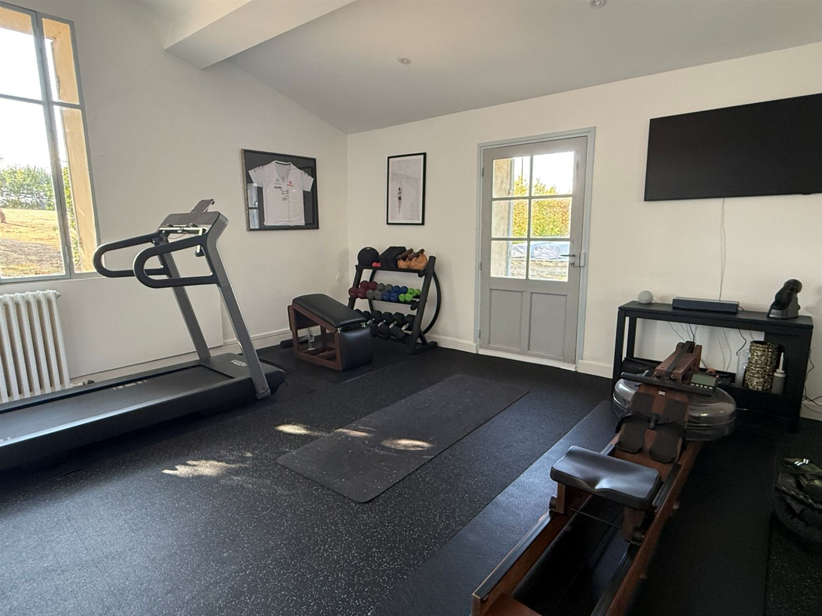 Gym with exposed stone wall