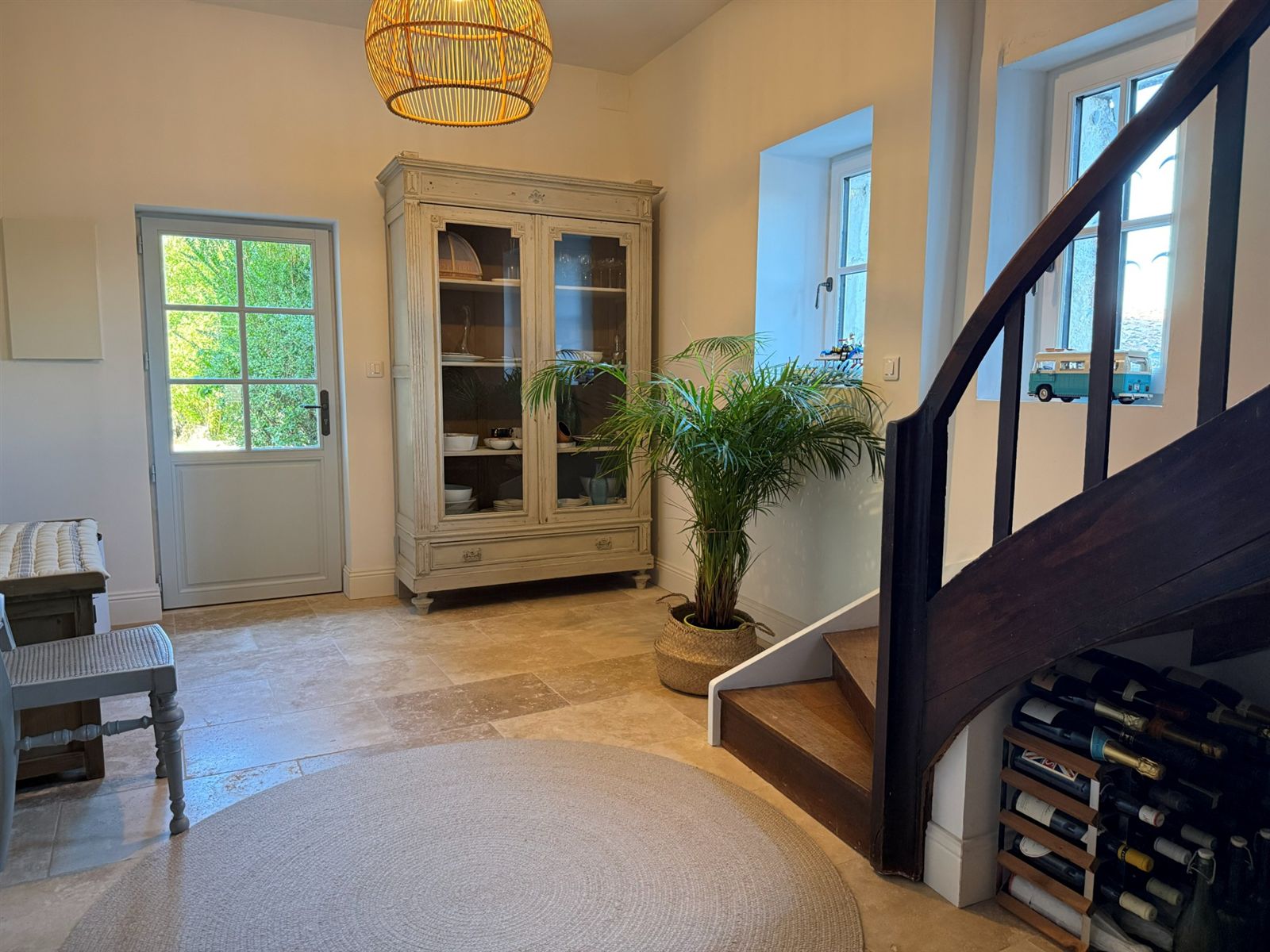 Back entrance with a glazed door, built-in cupboard and staircase