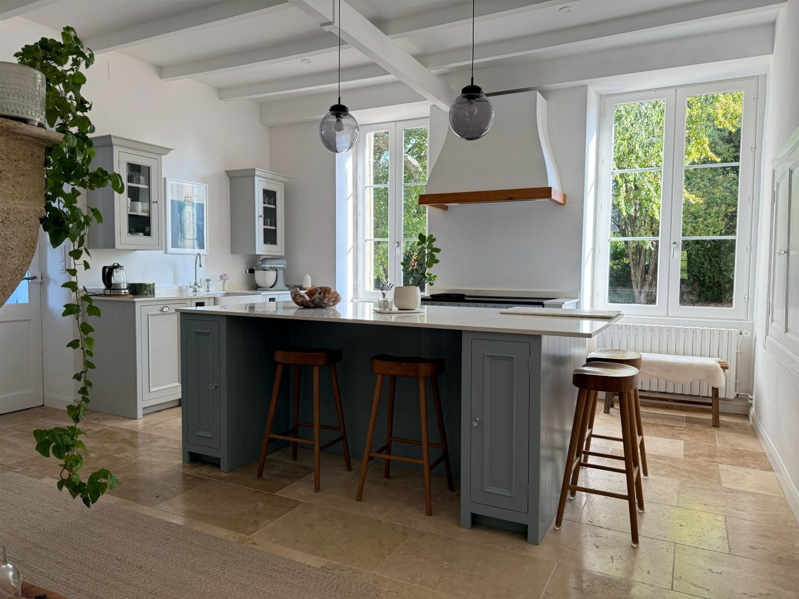 Painted kitchen island and tall windows