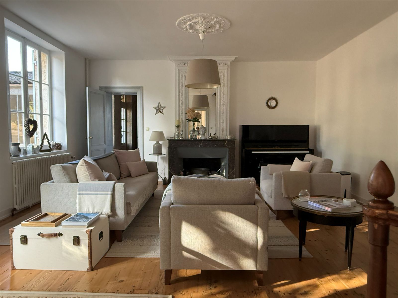 Entrance lounge with fireplace and garden windows