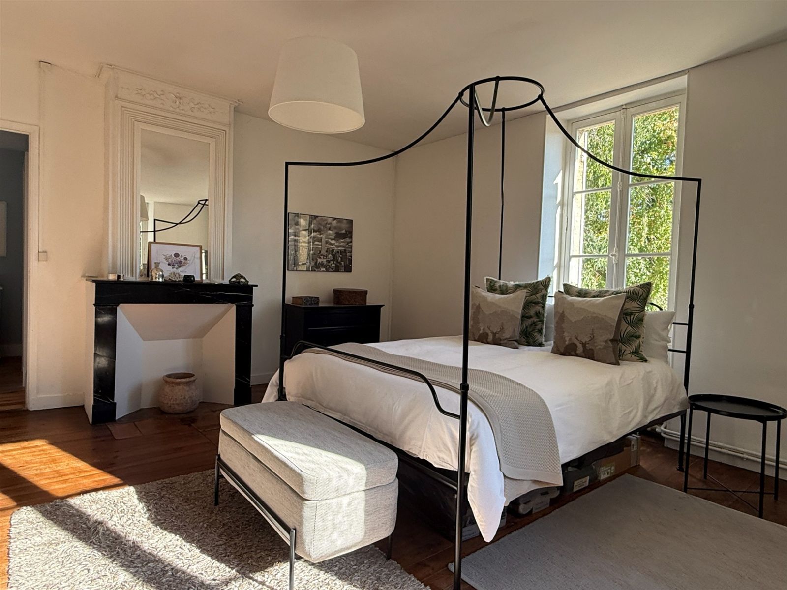 Black and white bedroom viewed from the doorway