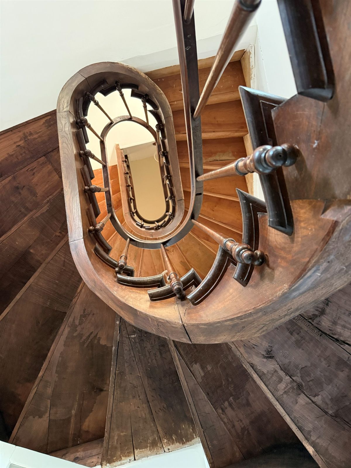 Looking down the curved timber staircase